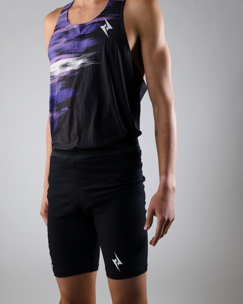 POLERA RUNNING ELITE MORADA
